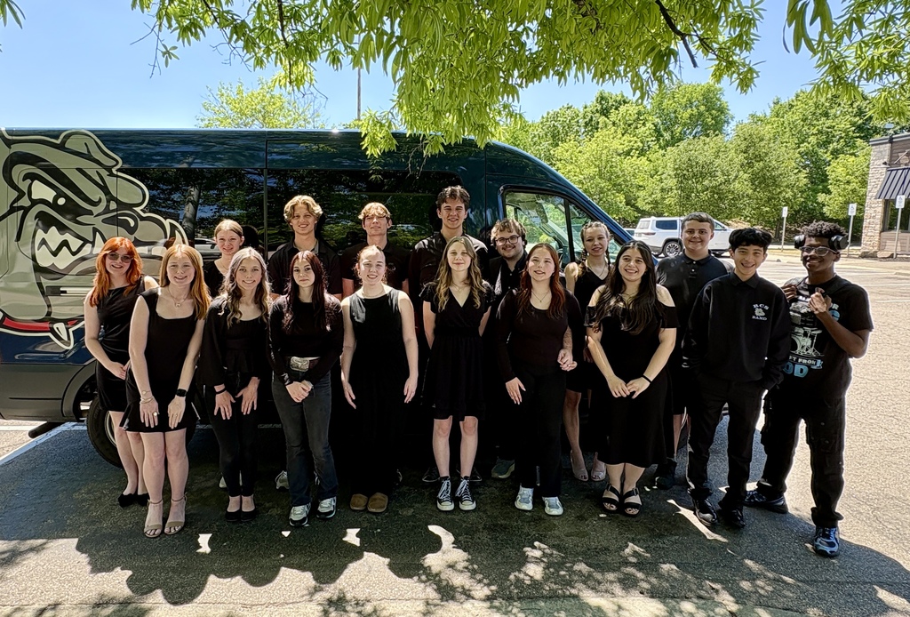 The RCS Jazz band standing in front of the RCS van.