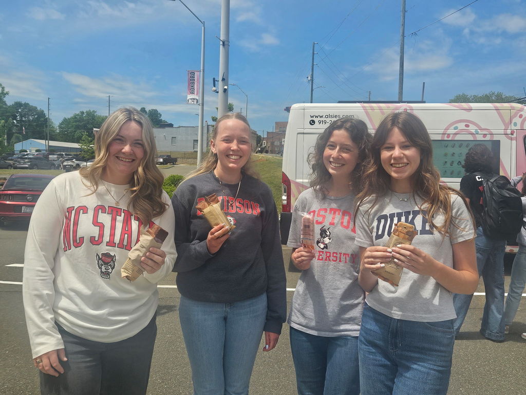 4 high school students holding ice cream and popsicles