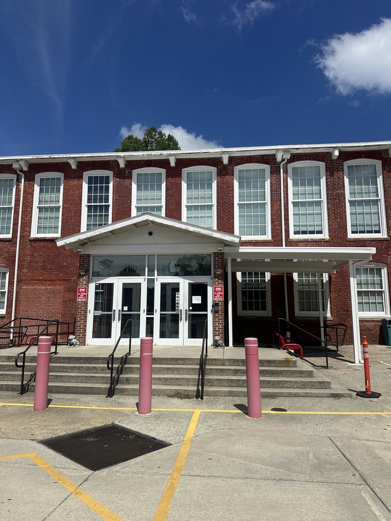 The front of RCS with a new white awning installed to the right of the front doors. 