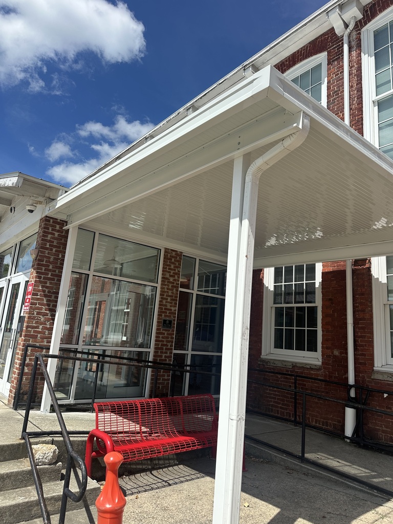 The new white awning that is attached the right side of the front entrance of RCS. 