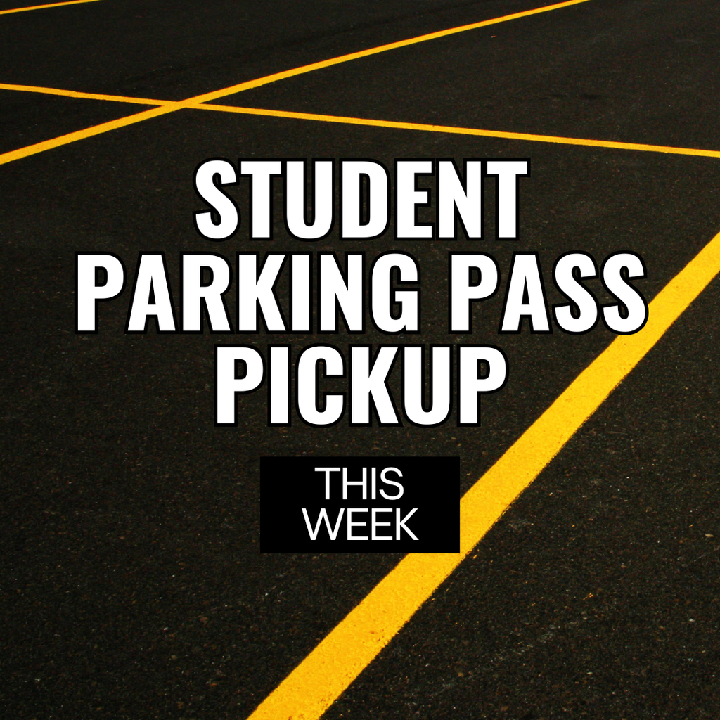 Yellow parking lines on black pavement with the text "Student Parking Pass Pickup This Week" on top of it. 