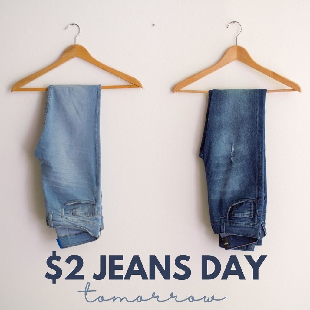 Jeans Day Graphic with two pairs of jeans on 2 hangers with the words "$2 Jeans Day Tomorrow" below them