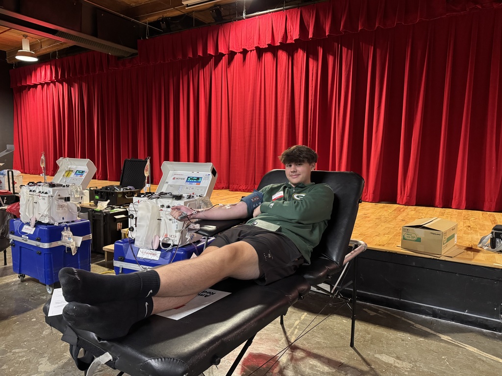 A teenage boy giving blood