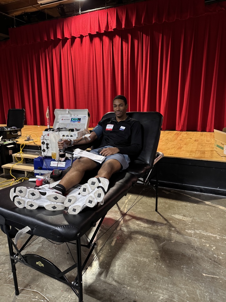 A teenage boy giving blood