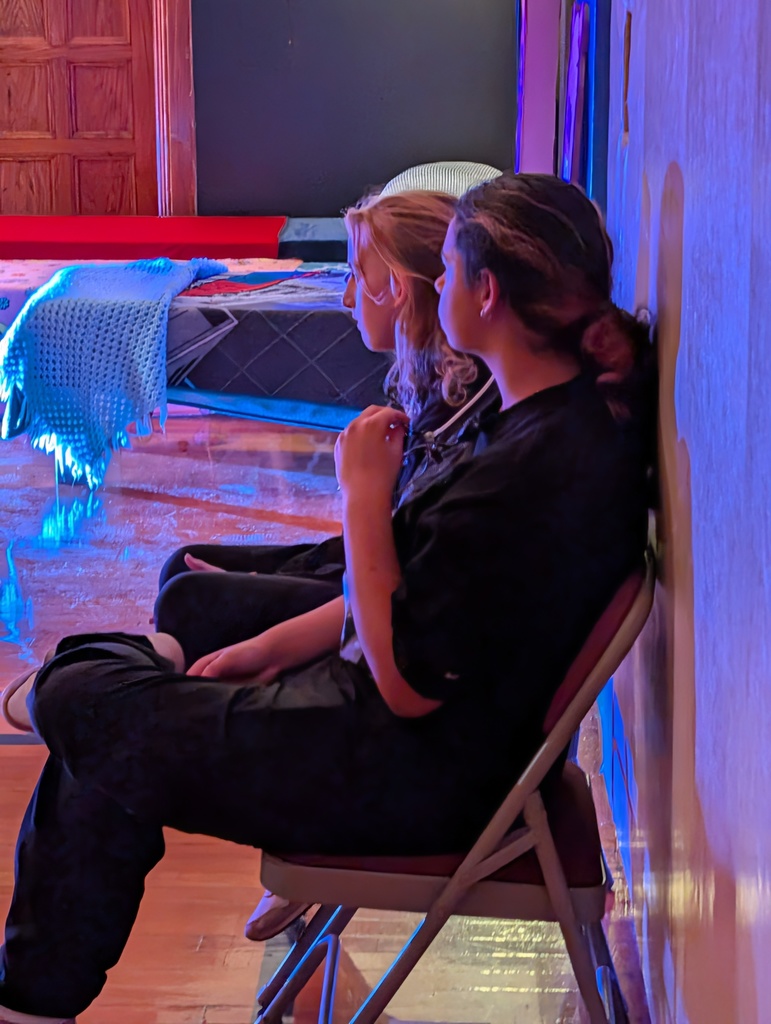 Student Stage hands watching the play