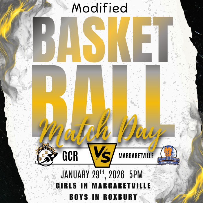 The image is a graphic poster with a dramatic sports design. Large gold and gray text in the center reads “Modified Basketball Match Day.” Below the text are two team logos: the GCR logo on the left and the Margaretville Blue Devils logo on the right, separated by a “VS” symbol. The bottom of the poster displays the details: “January 29th, 2026, 5PM. Girls in Margaretville. Boys in Roxbury.” The background is textured in black, white, and gold with flame-like accents around the edges, giving the poster an energetic, competitive feel.