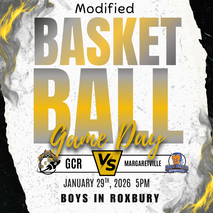 The image is a graphic poster with a dramatic sports design. Large gold and gray text in the center reads “Modified Basketball Match Day.” Below the text are two team logos: the GCR logo on the left and the Margaretville Blue Devils logo on the right, separated by a “VS” symbol. The bottom of the poster displays the details: “January 29th, 2026, 5PM. Boys in Roxbury.” The background is textured in black, white, and gold with flame-like accents around the edges, giving the poster an energetic, competitive feel.