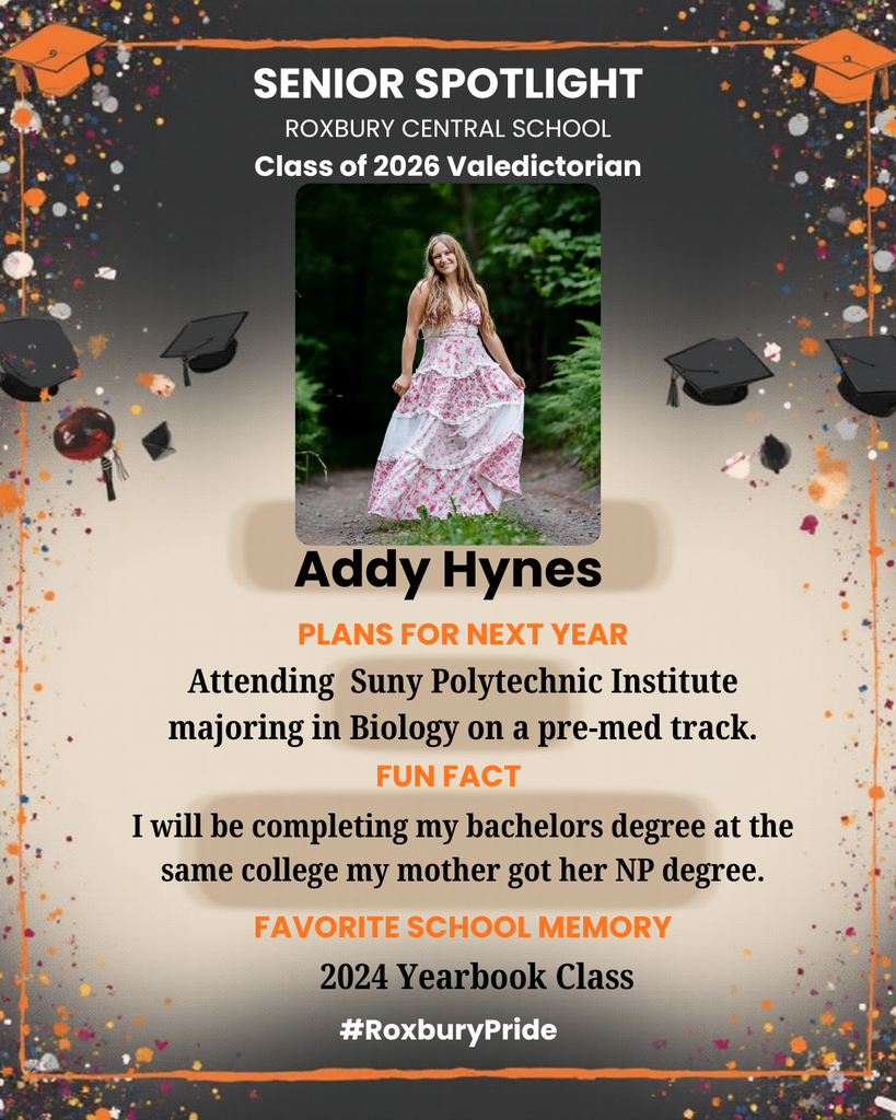 A “Senior Spotlight” graphic celebrates Addy Hynes as the Class of 2026 Valedictorian at Roxbury Central School. The background is dark with colorful confetti and graduation caps decorating the edges. In the center is a portrait of Addy standing on a wooded path, smiling and wearing a long, flowing white dress with a pink floral pattern. The text below explains that she plans to attend SUNY Polytechnic Institute to major in Biology on a pre-med track. A fun fact mentions she will attend the same college where her mother earned her nurse practitioner degree, and her favorite school memory is the 2024 Yearbook Class. The hashtag #RoxburyPride is displayed at the bottom.