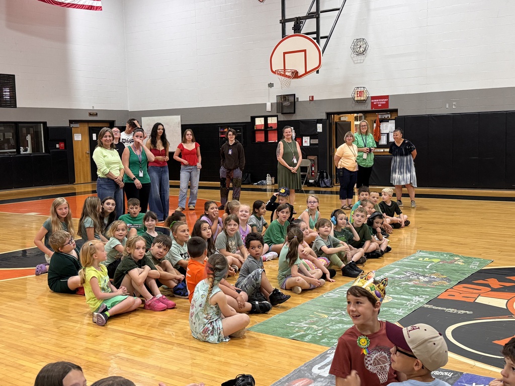 Elementary Green Team sit waiting for the game to begin