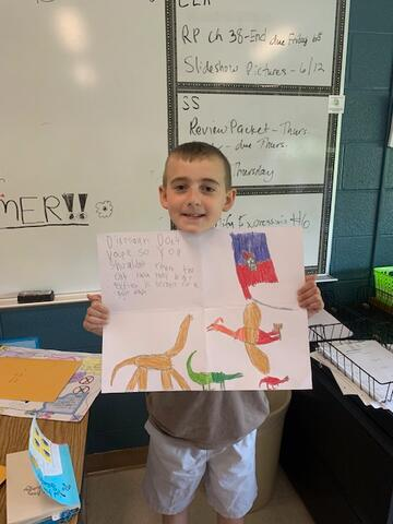 Gianni holding his poster up proudly