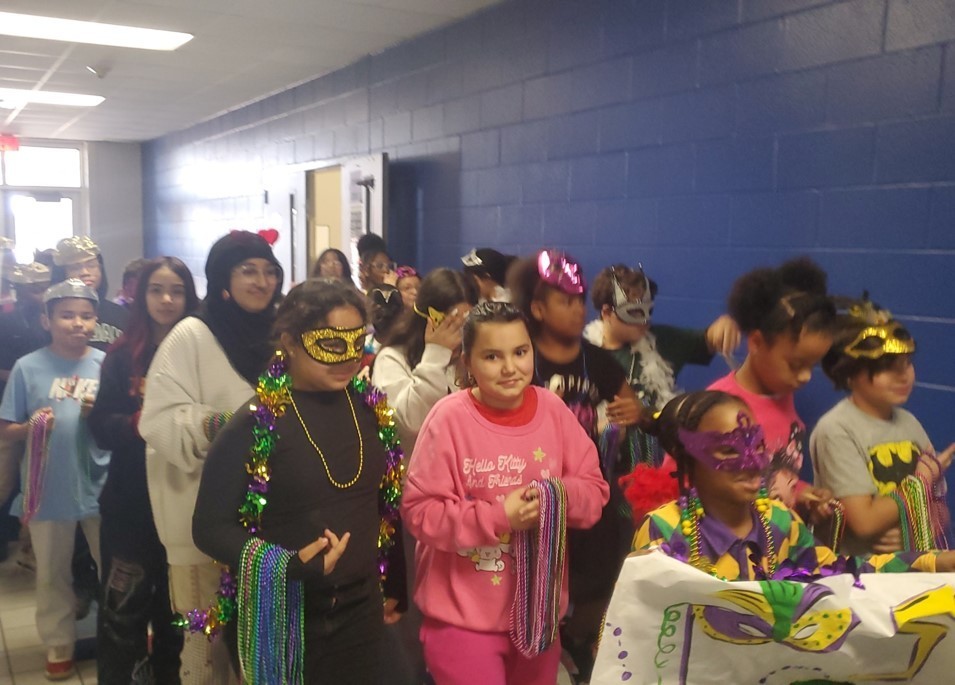 What is a Mardi Gras Parade without B...E...A...D...S ?!?!?! RES's Student Council Members tossed the highly anticipated beads out to the students! 2.9.26