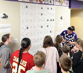 students placing panthers on board