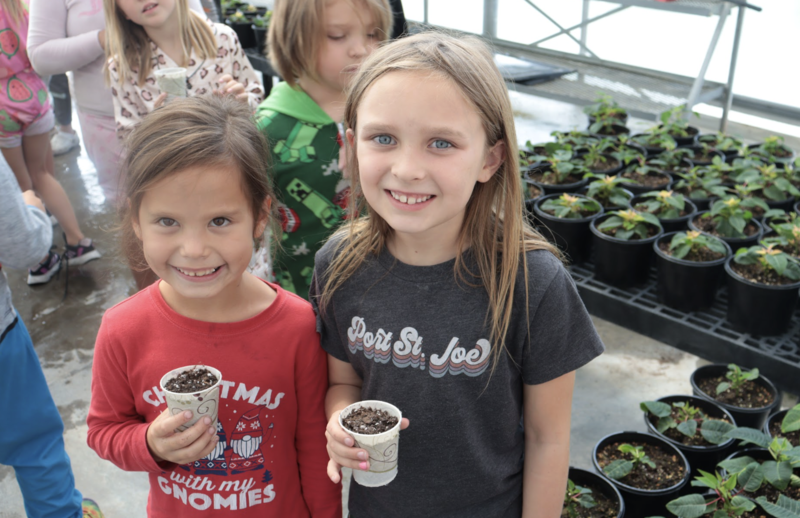 STEM kids planting plants 