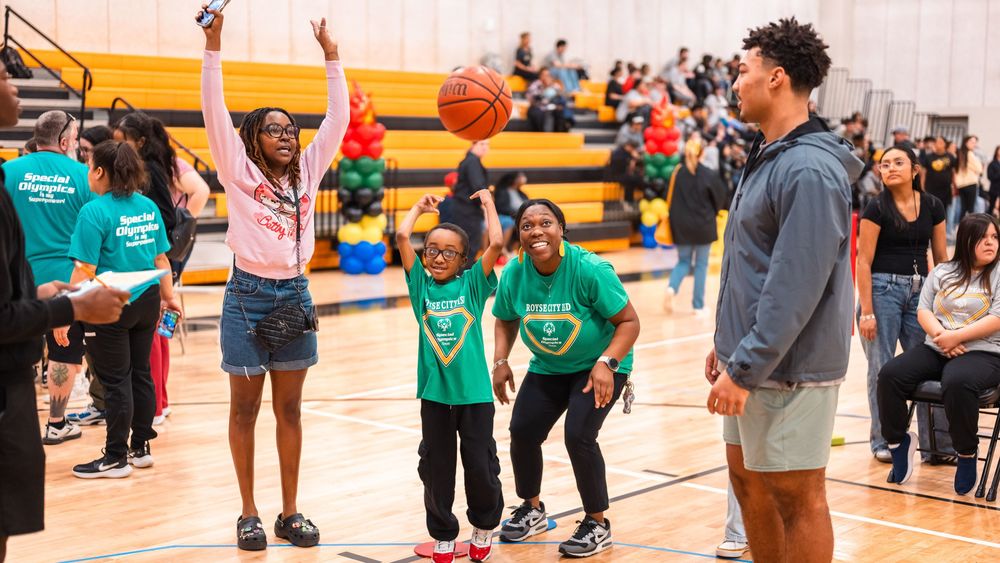 Special Olympic Athlete and Fans Cheer During Basketball Shot