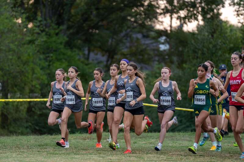 Girls running at the track meet