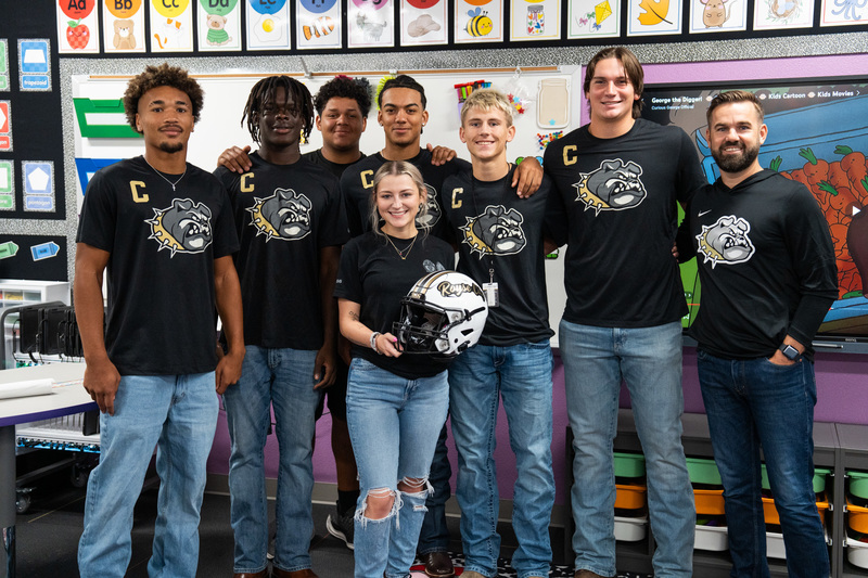 Football presenting Aubrey Dawson with RCHS FB Helmetenting Aubrey Dawson with RCHS FB Helmet