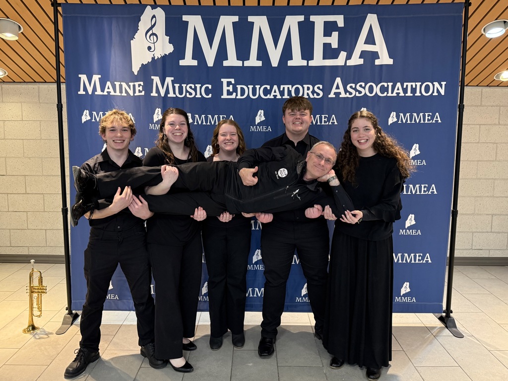 Mr. Neal is so happy he's levitating. (Students holding Mr. Neal) 