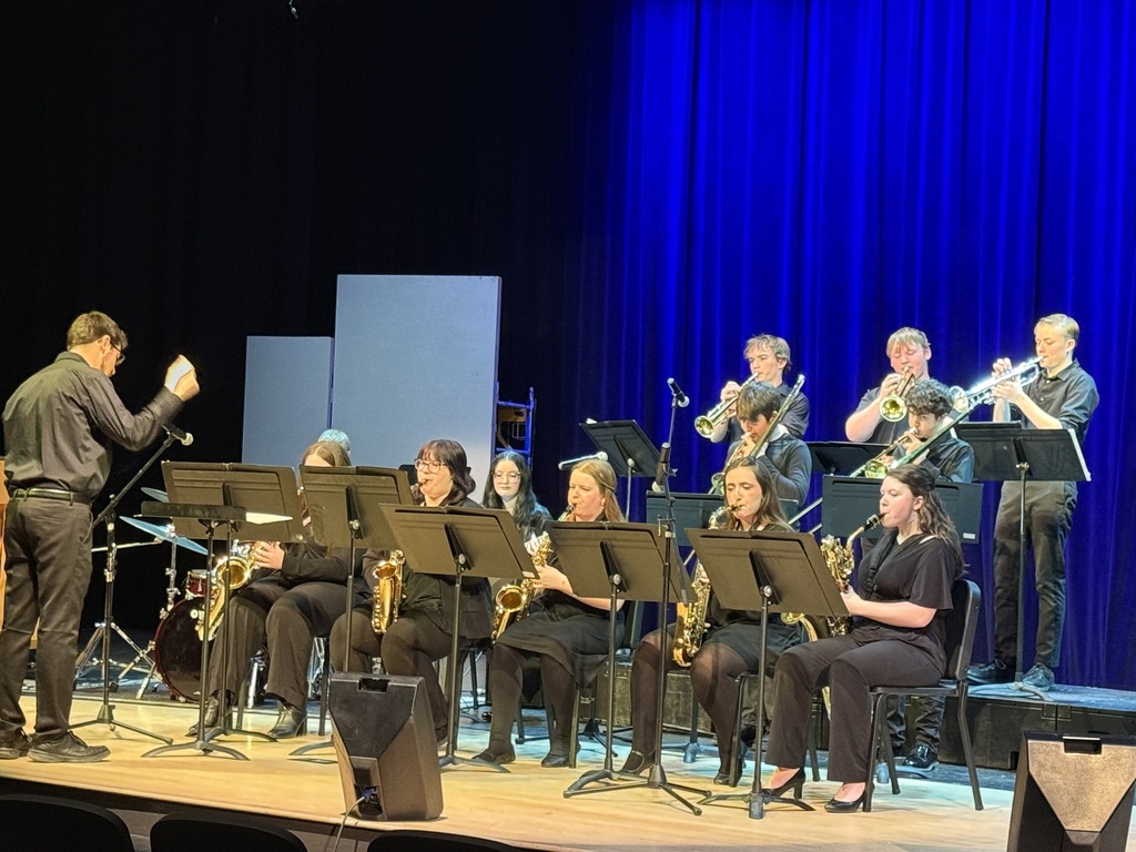 The jazz band is deep into the song. 