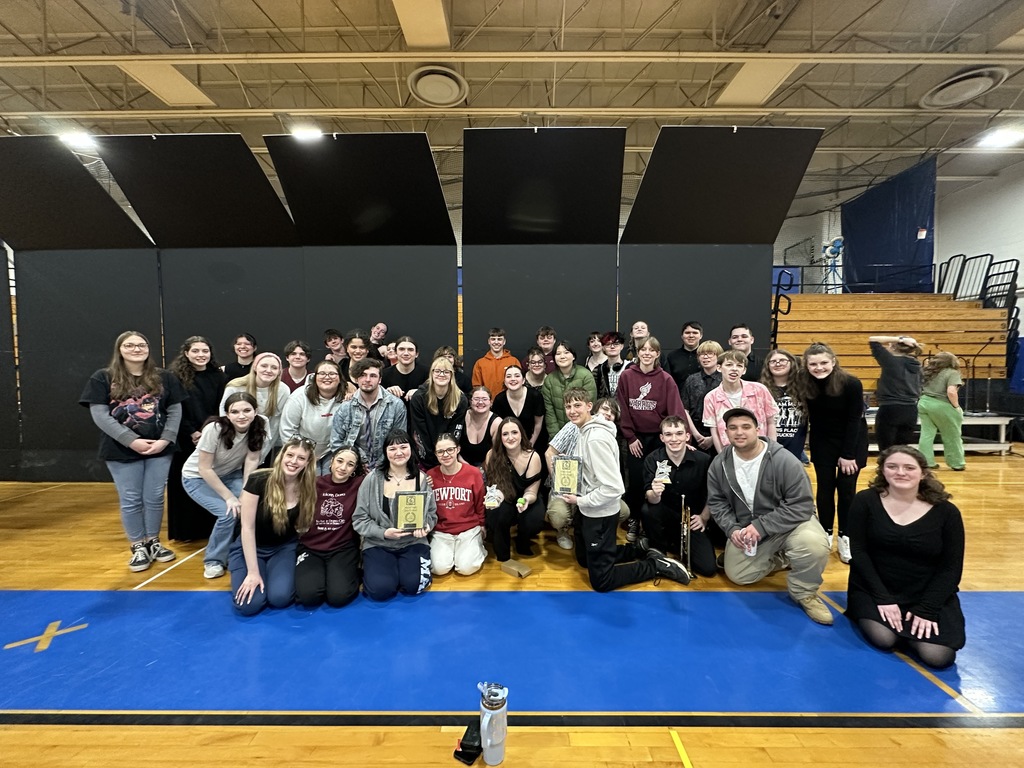 Vocal Jazz and Show Choir students smiling in a group photo. 