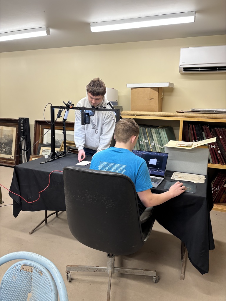 Students look through archives