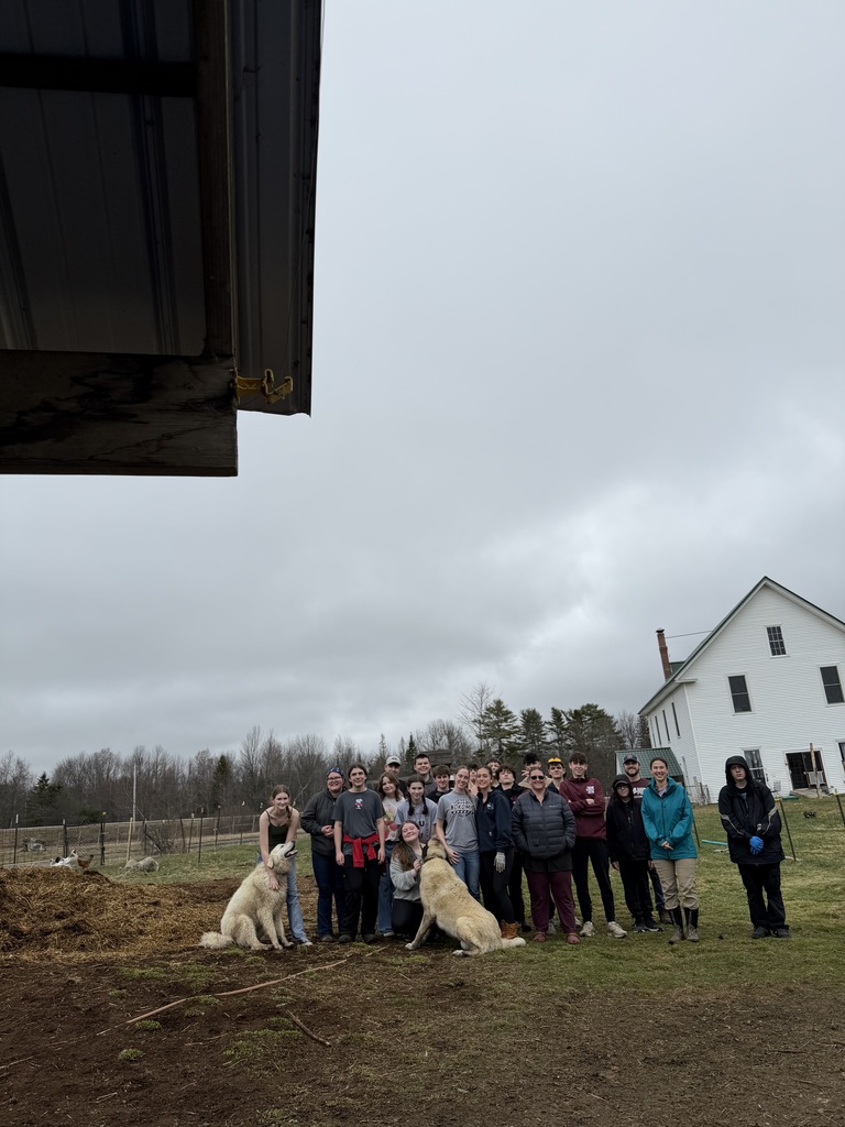 Dr. Marzulla and Mr. Avery's advisories helping out on the farm.