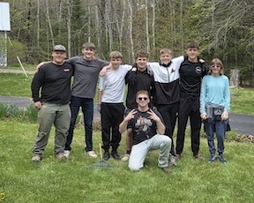 JROTC pose in a yard that they cleaned up.