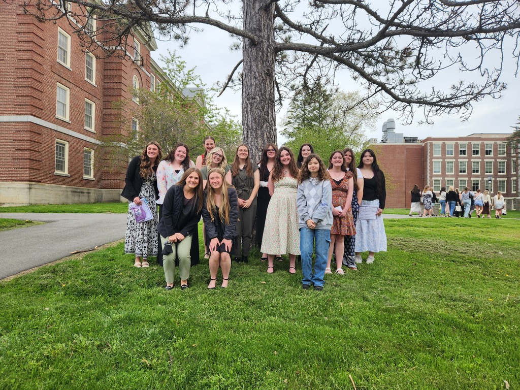 Olympia Snowe Women's Leadership Institute participants from Nokomis Regional High pose in front of a tree at UMO.