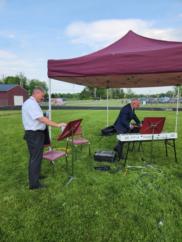 Mr. Hammer and Dean Neal setting up