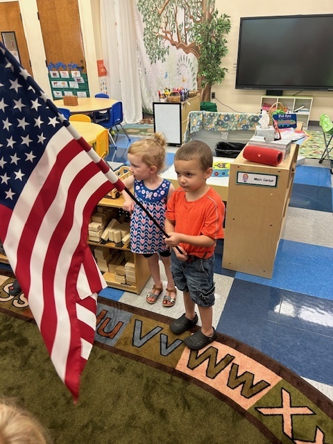 Pre-k with an American flag.