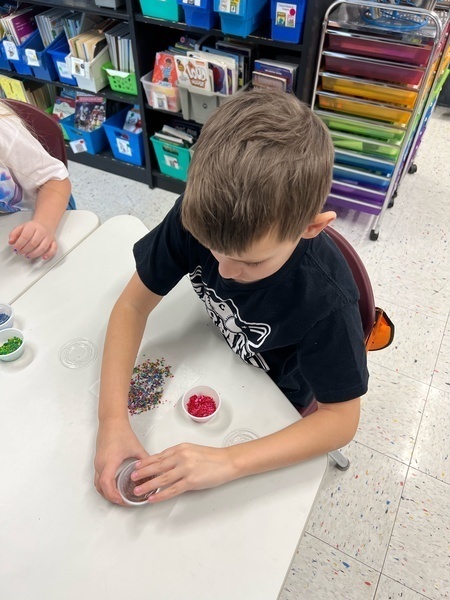 Boy in black shirt crafting