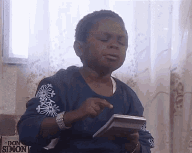 Young boy using a calculator to do math