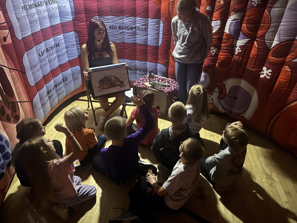 Litze Bolanos and Ellison Riedy work together at the heart station