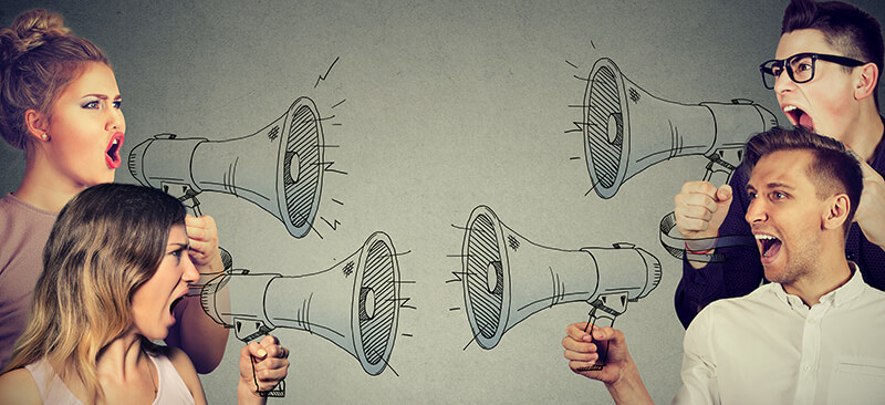 People Yelling at One Another with Megaphones