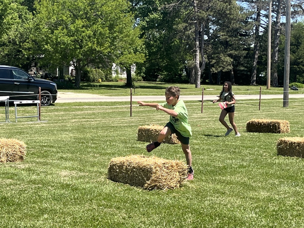 Jumping over a bale of hay
