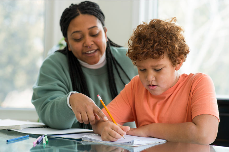 Paraprofessional working with a student