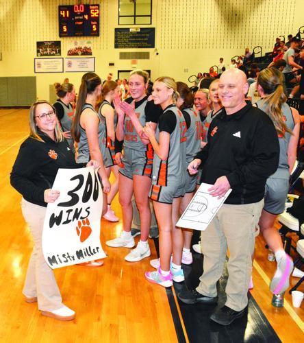 Coach Misty Davis Miller is all smiles after winning her sixth regional title and career victory number 300. 