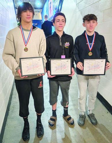 Pictured, from left, are Russell County state wrestling champions Ian Ray, Carter Dye and Hunter Dye.   Submitted photo