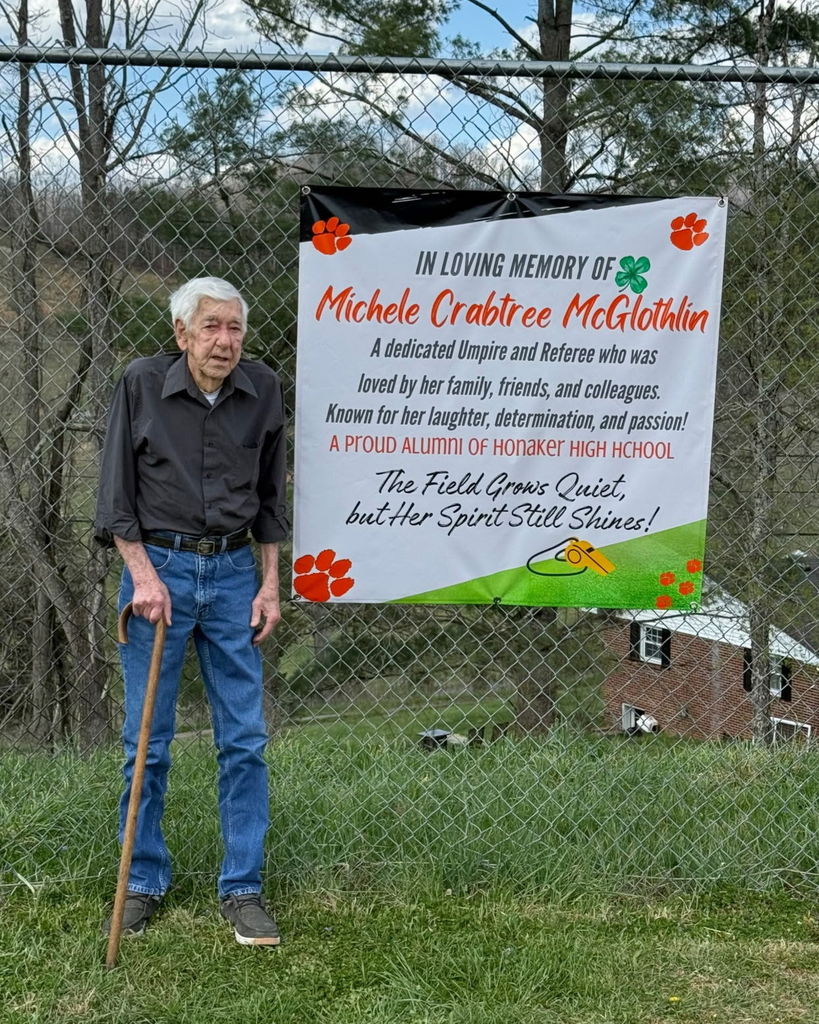 JB with Michele McGlothlins banner.