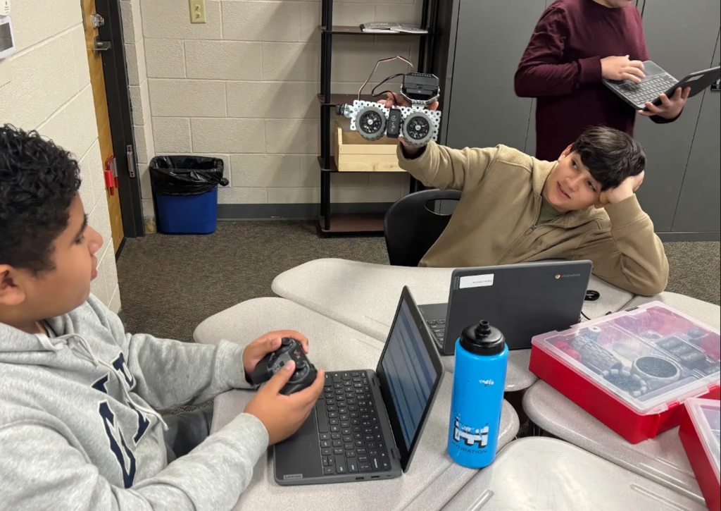 students collaborating on robots