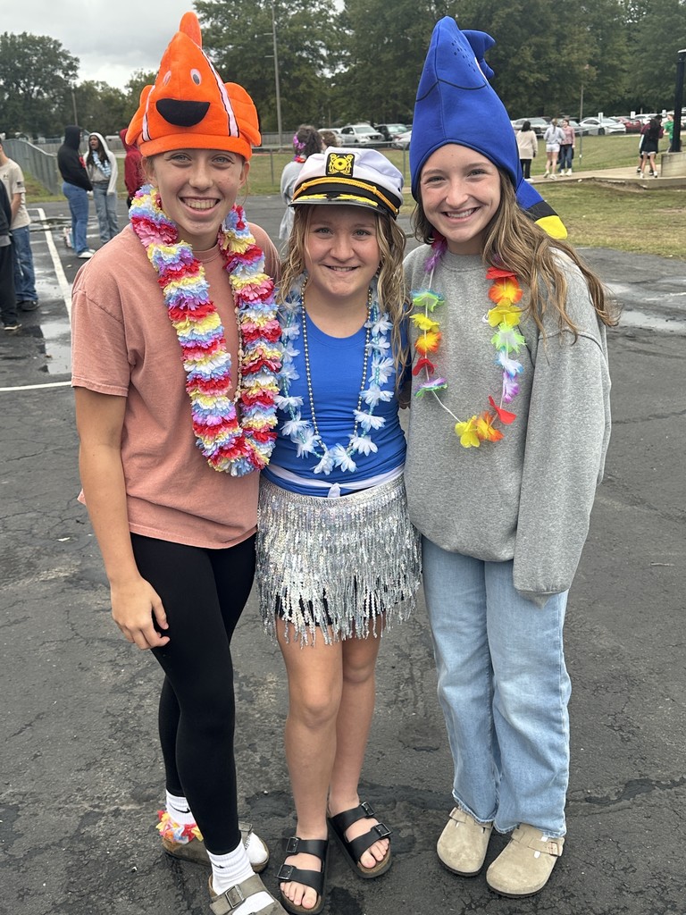 students dressed in Hawaiian-themed clothes