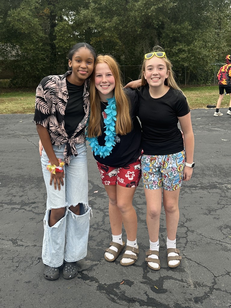 students dressed in Hawaiian-themed clothes