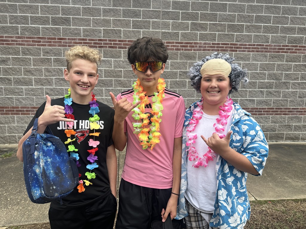 students dressed in Hawaiian-themed clothes