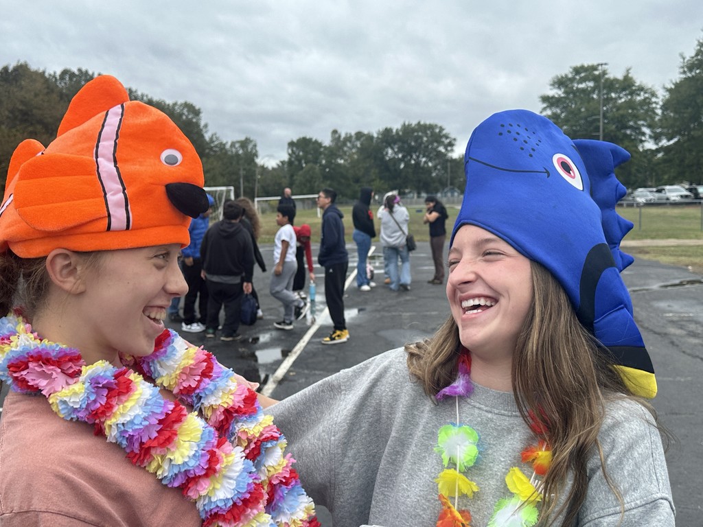 students dressed in Hawaiian-themed clothes