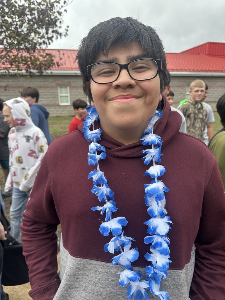 students dressed in Hawaiian-themed clothes