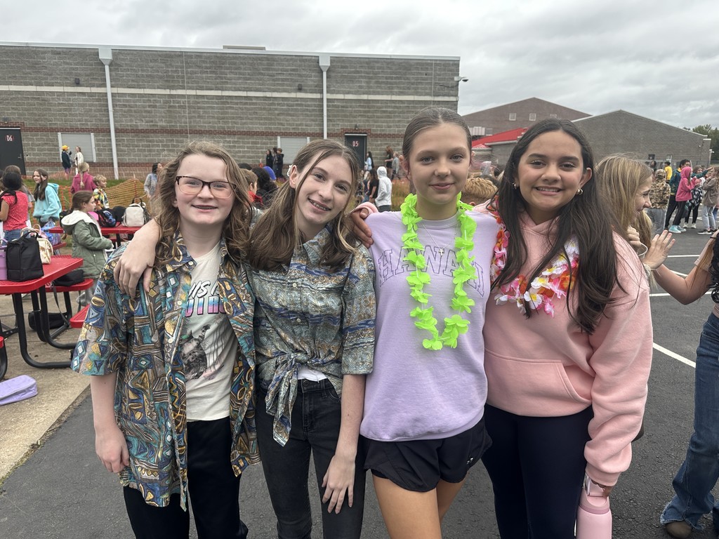 students dressed in Hawaiian-themed clothes