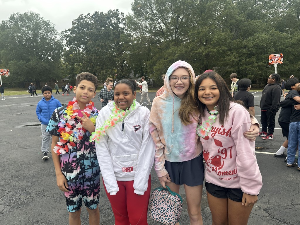 students dressed in Hawaiian-themed clothes