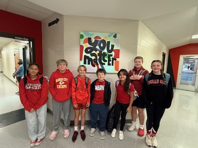 students dressed in red