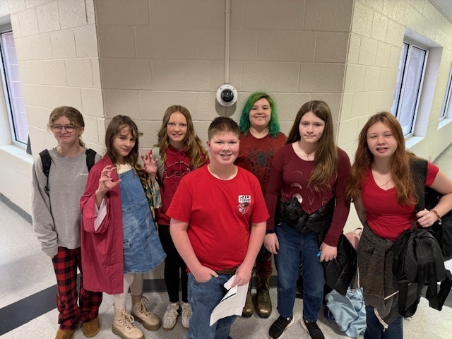 students dressed in red