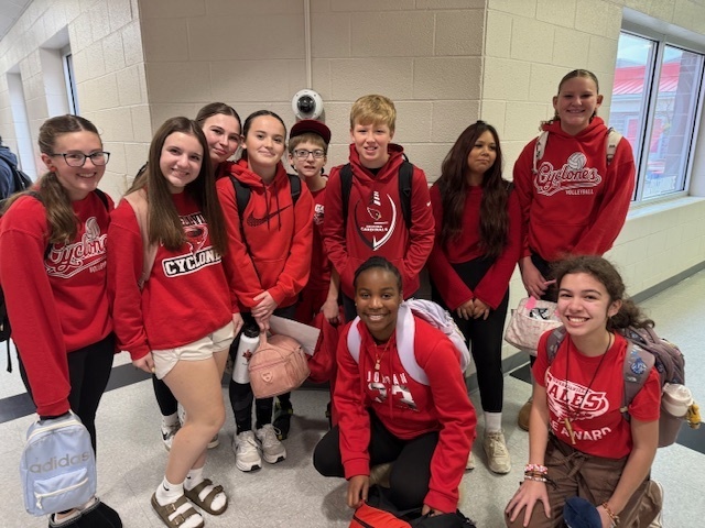 students dressed in red