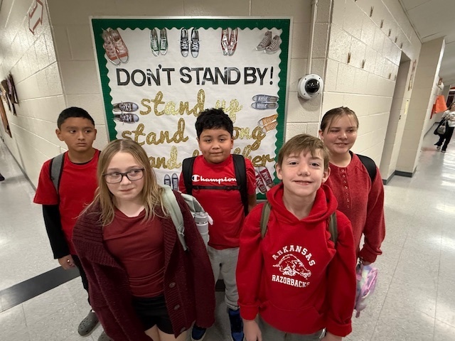 students dressed in red